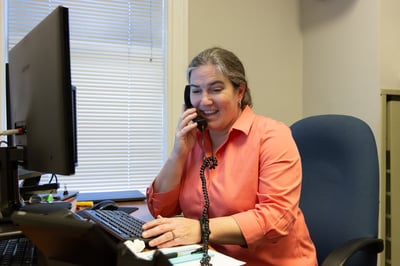 Julia at Desk Phone